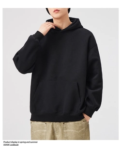 Oversized black hoodie with kangaroo pocket and ribbed cuffs in soft cotton blend