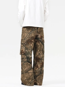 Rear view of loose cargo pants with realistic branch camo pattern and large side pockets