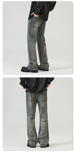 Detail of vintage washed wide-leg denim jeans with retro rear pockets and stitching