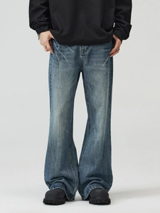 Vintage wash flare denim jeans for men featuring cat-whisker fading and street style