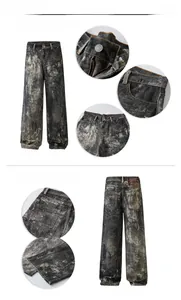Detail view of washed heavy denim fabric textures and reinforced stitching on wide-leg jeans