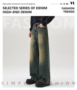 Detail of vintage dirty wash wide-leg denim jeans with high-end texture and relaxed fit