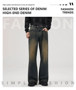 Close-up of vintage wash flared denim jeans with a metal letter D buckle leather belt