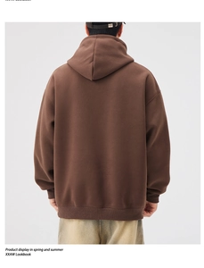 Back view of brown heavyweight hoodie featuring ribbed cuffs and drop shoulder style