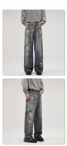 Macro view of wide-leg denim jeans with chain print and vintage wash effects