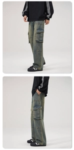 Detailed view of cargo denim pants with vintage wash finish and multiple pocket design
