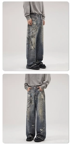 Detail view of retro wide-leg jeans featuring vintage wash with chain and lock prints