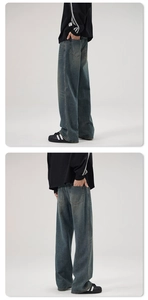 Detail view of vintage washed flared jeans with distressed textures and cleanfit style