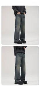 Nahaufnahme der Vintage-Waschung Jeans mit Whisker-Details und weitem geradem Bein
