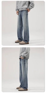 Détail du jean denim bleu clair délavé avec une coupe droite large de style rétro américain