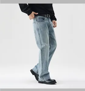 Detailed close-up of light blue vintage washed denim jeans with retro faded texture