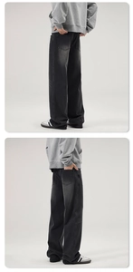 Detail view of American vintage high street black washed wide-leg flared jeans for men