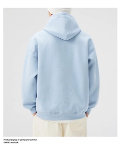 Back view of heavy light blue oversized hoodie with ribbed hem and drop shoulder design