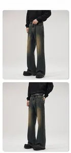 Detail view of vintage distressed wide-leg jeans with retro washed texture and cat whisker effect