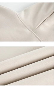 Detail of high-quality stitching and soft knitted texture on beige heavy hoodie