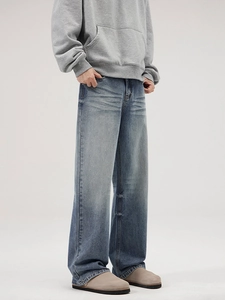 Jean denim ample à jambe droite pour homme avec délavage rétro bleu et effet moustaches vintage