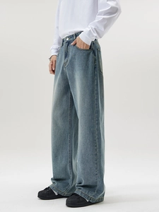 Men's wide leg light blue wash denim jeans in a trendy vintage minimalist straight cut