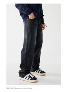 Detail of high street vintage washed lightning pattern straight leg denim pants for men