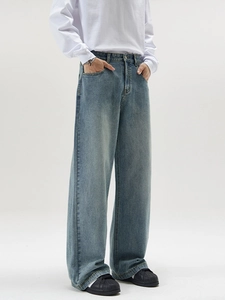 Classic light blue washed straight leg denim jeans with a loose high-waist vintage fit