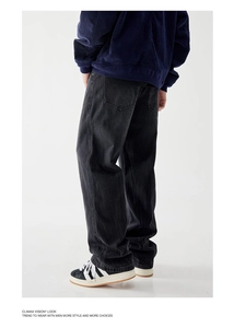 Rear view of vintage washed dark denim jeans in a straight-leg cut for men