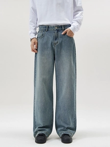Men's light blue straight leg jeans in a vintage wash and relaxed fit style