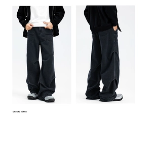 Detail view of men's loose-fit cargo denim pants in washed grey with a distinct O-shaped silhouette