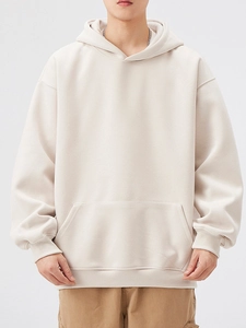 Oversized men's heavyweight cream hoodie with kangaroo pocket and ribbed cuffs