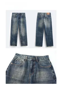 Dettaglio di jeans in denim lavato blu scuro con bottone in metallo e toppa in pelle
