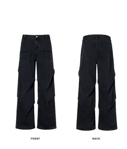 Front and back view of black parachute denim pants with side pleats and relaxed fit