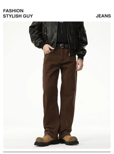 Detail view of vintage coffee-brown wide-leg cotton jeans with street style belt