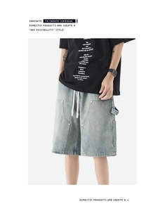 Detail of light blue washed denim shorts with white drawstring and workwear side loop