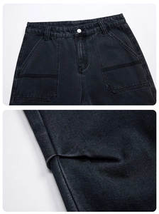 Detail of dark gray washed denim jeans showing high waist buttons and cargo pocket design