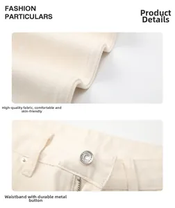 Macro shot of off-white cotton trousers with premium fabric and engraved metal button