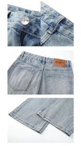 Detail view of American vintage light blue jeans with silver bird button and leather patch