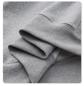 Detail of grey hoodie showing ribbed cuffs, soft fleece lining and high-quality stitching