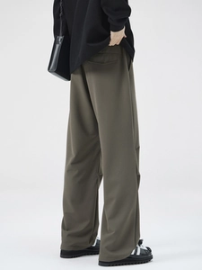 Men's olive green straight leg trousers with elegant drape and pleated texture
