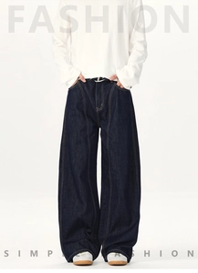 Detailed view of high-waist dark blue wide-leg jeans featuring vertical twin stitching