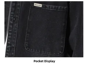 Detail of chest pocket on black washed denim jacket with premium woven logo tag