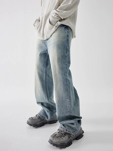 Men's vintage washed light blue wide-leg jeans with whiskers and retro street style