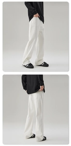 Detailed views of white flare denim trousers showing clean-fit cut and premium fabric texture