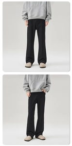 Detail view of men's black stretch flared jeans in cleanfit style and heavy twill fabric