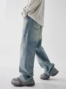 Vintage light blue washed wide-leg denim jeans for men featuring a retro street style look