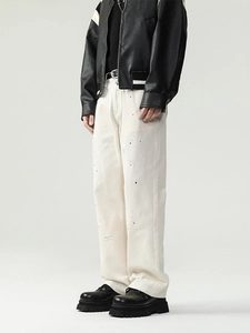 Men's off-white straight leg jeans with artistic black ink splash and distressed details