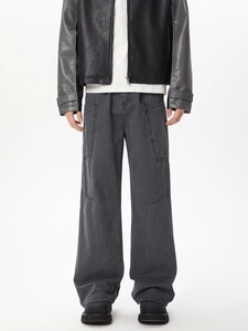 Detail shot of vintage washed dark grey wide-leg cargo pants in premium denim cotton