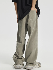 Men's baggy cargo pants with distressed wash and tactical pocket detailing