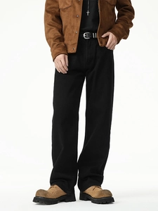 Men's cleanfit black straight-leg denim jeans with retro street style in white studio