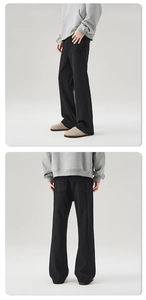 Detailed view of black wide-leg trousers in high-quality fabric for an urban look