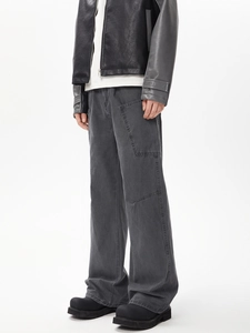 Detail of loose fit multi-pocket cargo pants and vintage washed cotton texture