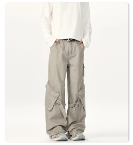 Detail showing multi-pocket cargo pants with adjustable straps and twill fabric texture