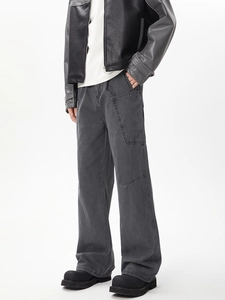 Detail view of washed dark grey multi-pocket cargo pants in a relaxed straight fit
